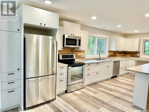 720 Railway Ave, Chitek Lake, SK - Indoor Photo Showing Kitchen With Double Sink