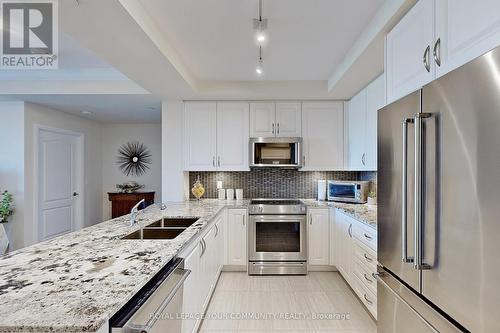 207 - 25 Baker Hill Boulevard, Whitchurch-Stouffville, ON - Indoor Photo Showing Kitchen With Stainless Steel Kitchen With Double Sink With Upgraded Kitchen