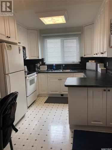 701 Hudson Crescent, Hudson Bay, SK - Indoor Photo Showing Kitchen With Double Sink