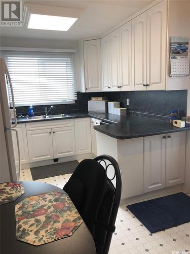 701 Hudson Crescent, Hudson Bay, SK - Indoor Photo Showing Kitchen With Double Sink