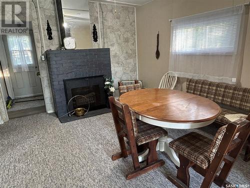 306 Douglas Avenue, Manitou Beach, SK - Indoor Photo Showing Dining Room With Fireplace