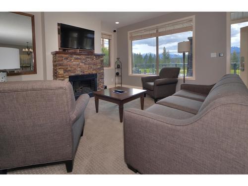 611A - 600 Bighorn Boulevard, Radium Hot Springs, BC - Indoor Photo Showing Living Room With Fireplace