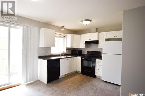 104 4601 Child Avenue, Regina, SK - Indoor Photo Showing Kitchen With Double Sink
