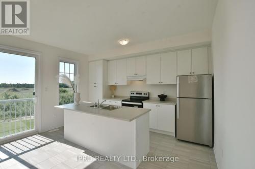 12 Shapira Avenue, Wasaga Beach, ON - Indoor Photo Showing Kitchen With Double Sink