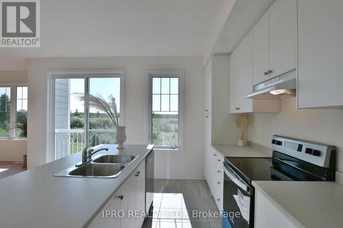 12 Shapira Avenue, Wasaga Beach, ON - Indoor Photo Showing Kitchen With Double Sink