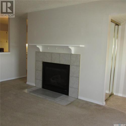 156 Gore Place, Regina, SK - Indoor Photo Showing Living Room With Fireplace