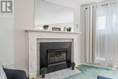 Gas fireplace heats the unit - 103 - 729 Deveron Crescent, London, ON - Indoor Photo Showing Living Room With Fireplace