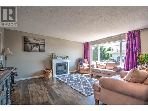 1303 28Th Avenue, Vernon, BC - Indoor Photo Showing Living Room With Fireplace