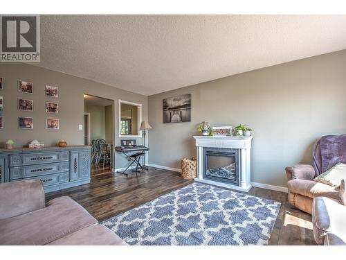 1303 28Th Avenue, Vernon, BC - Indoor Photo Showing Living Room With Fireplace