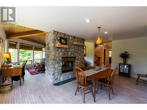 4625 Crescent View  Drive, Nelson, BC - Indoor Photo Showing Dining Room With Fireplace