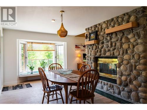 4625 Crescent View  Drive, Nelson, BC - Indoor Photo Showing Dining Room With Fireplace