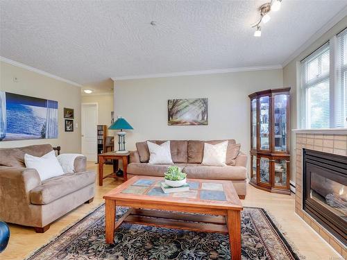 103-1663 Mckenzie Ave, Saanich, BC - Indoor Photo Showing Living Room With Fireplace