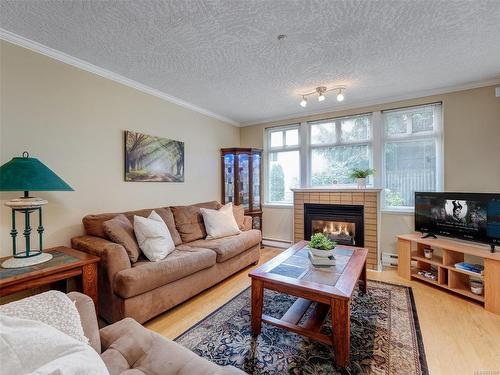 103-1663 Mckenzie Ave, Saanich, BC - Indoor Photo Showing Living Room With Fireplace