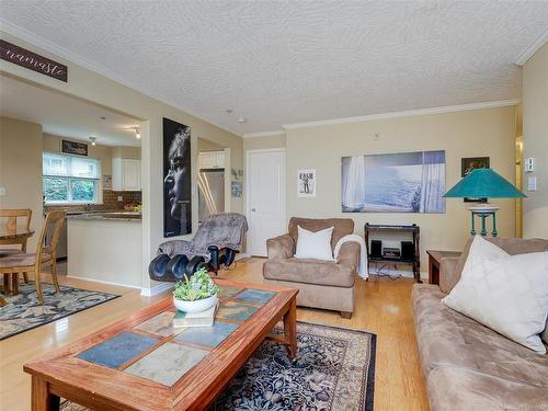 103-1663 Mckenzie Ave, Saanich, BC - Indoor Photo Showing Living Room With Fireplace