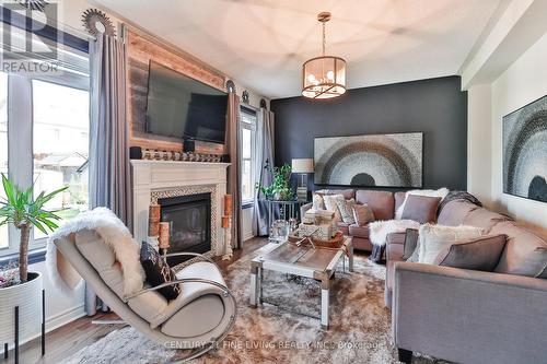 48 Collier Crescent, Essa, ON - Indoor Photo Showing Living Room With Fireplace