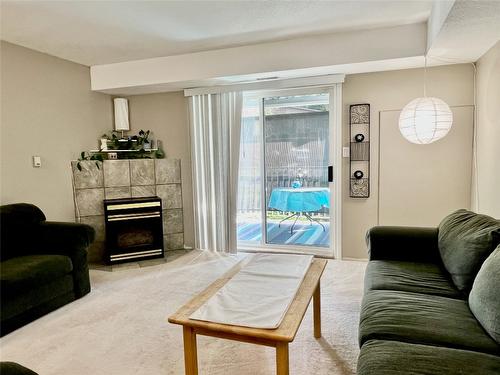 212-3929 22 Avenue, Vernon, BC - Indoor Photo Showing Living Room With Fireplace