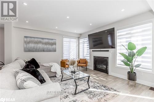 45 Wood Crescent, Essa, ON - Indoor Photo Showing Living Room With Fireplace