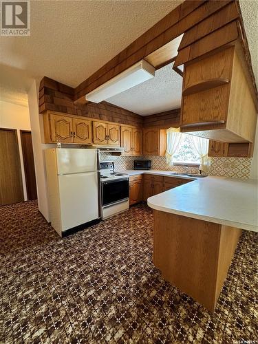 720 Donald Street, Hudson Bay, SK - Indoor Photo Showing Kitchen With Double Sink