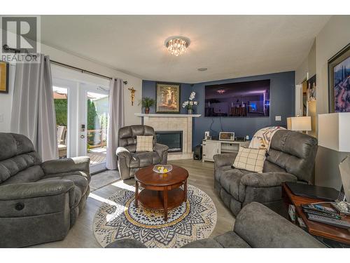 4646 Ryser Court, Prince George, BC - Indoor Photo Showing Living Room With Fireplace