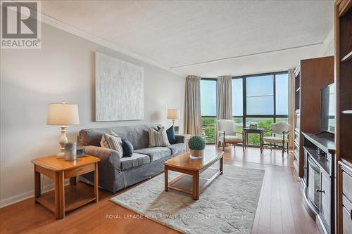 702 - 1230 Marlborough Court, Oakville (College Park), ON - Indoor Photo Showing Living Room