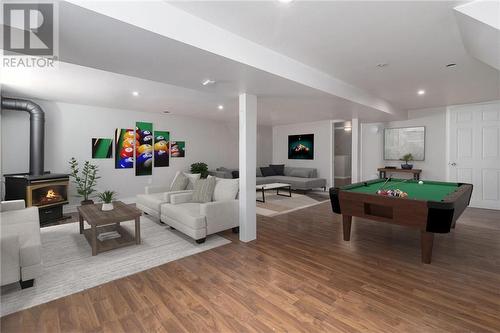 Family room virtually staged - 840 Stewart Boulevard, Brockville, ON - Indoor Photo Showing Other Room With Fireplace