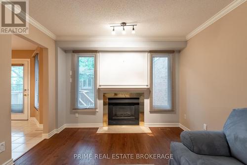 8 - 70 Sunnyside Drive, London, ON - Indoor Photo Showing Living Room With Fireplace