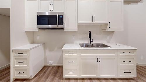 45 Fieldstone Crescent, Brandon, MB - Indoor Photo Showing Kitchen With Double Sink