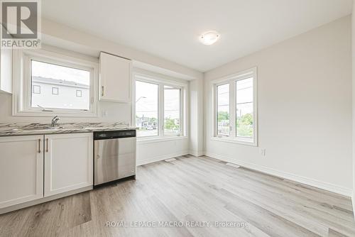 12 Reid Avenue N, Hamilton (Mcquesten), ON - Indoor Photo Showing Kitchen With Double Sink