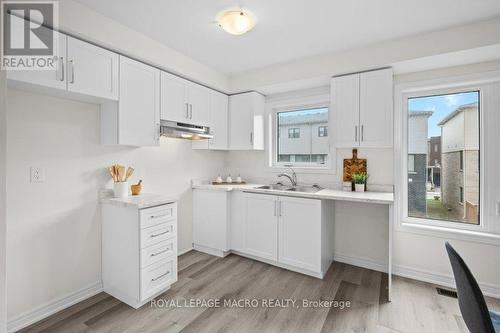 12 Reid Avenue N, Hamilton, ON - Indoor Photo Showing Kitchen With Double Sink