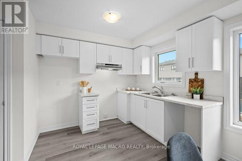 12 Reid Avenue N, Hamilton, ON - Indoor Photo Showing Kitchen With Double Sink