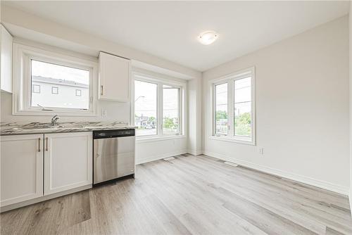 12 Reid Avenue N, Hamilton, ON - Indoor Photo Showing Kitchen With Double Sink