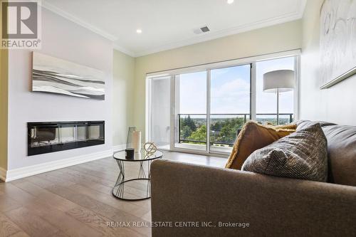 308 - 1878 Gordon Street, Guelph (Guelph South), ON - Indoor Photo Showing Living Room With Fireplace