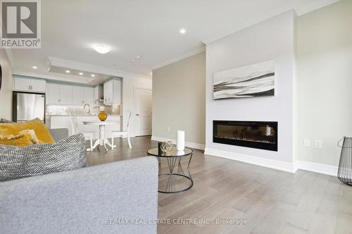 308 - 1878 Gordon Street, Guelph (Guelph South), ON - Indoor Photo Showing Living Room With Fireplace