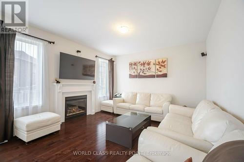 16 Birch Tree Trail, Brampton, ON - Indoor Photo Showing Living Room With Fireplace