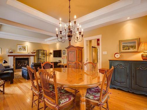 Dining room - 500 Rue Des Rosiers, Sainte-Adèle, QC - Indoor Photo Showing Dining Room With Fireplace