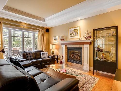 Living room - 500 Rue Des Rosiers, Sainte-Adèle, QC - Indoor Photo Showing Living Room With Fireplace