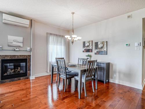 Dining room - 302-800 Boul. Lucille-Teasdale, Terrebonne (Lachenaie), QC - Indoor Photo Showing Dining Room With Fireplace