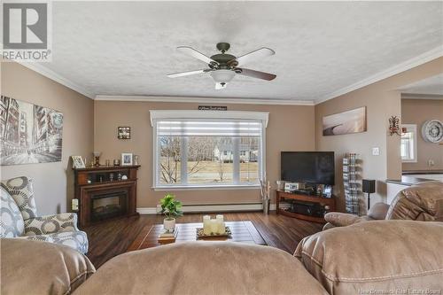 32 Moise, Rogersville, NB - Indoor Photo Showing Living Room With Fireplace