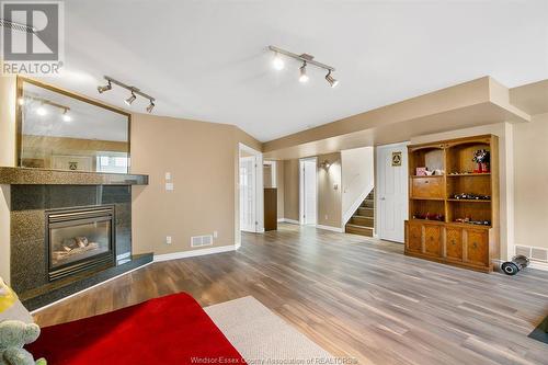 11089 Ancona Crescent, Windsor, ON - Indoor Photo Showing Living Room With Fireplace