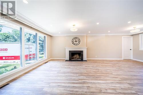 720 Cartier Drive, Windsor, ON - Indoor Photo Showing Other Room With Fireplace