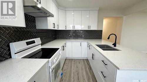 A And B 2200 Harvey Street, Regina, SK - Indoor Photo Showing Kitchen With Double Sink