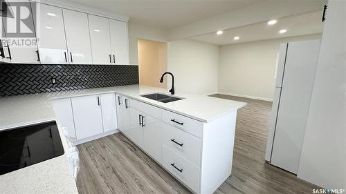 A And B 2200 Harvey Street, Regina, SK - Indoor Photo Showing Kitchen With Double Sink