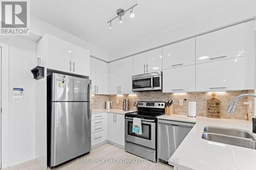 325 - 28 Prince Regent Street, Markham, ON - Indoor Photo Showing Kitchen With Stainless Steel Kitchen With Double Sink With Upgraded Kitchen