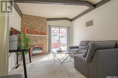 414 T Avenue N, Saskatoon, SK - Indoor Photo Showing Living Room With Fireplace