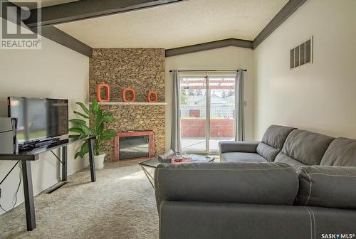 414 T Avenue N, Saskatoon, SK - Indoor Photo Showing Living Room With Fireplace