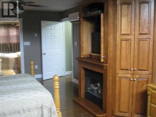 126 Georgetown Road, Corner Brook, NL - Indoor Photo Showing Bedroom With Fireplace