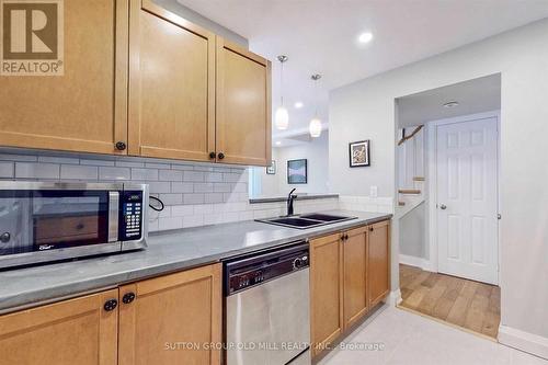 56 - 50 Turntable Crescent, Toronto (Dovercourt-Wallace Emerson-Junction), ON - Indoor Photo Showing Kitchen With Double Sink