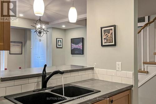 56 - 50 Turntable Crescent, Toronto (Dovercourt-Wallace Emerson-Junction), ON - Indoor Photo Showing Kitchen With Double Sink