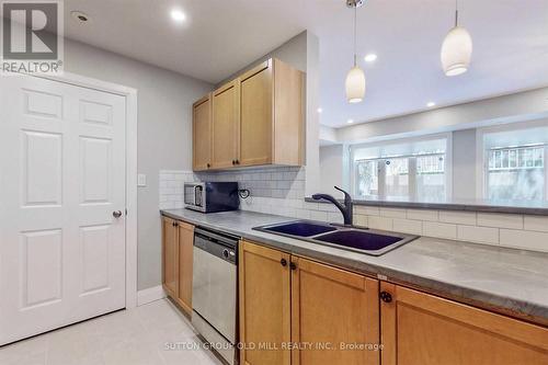 56 - 50 Turntable Crescent, Toronto (Dovercourt-Wallace Emerson-Junction), ON - Indoor Photo Showing Kitchen With Double Sink