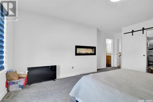 4154 Fieldstone Way, Regina, SK - Indoor Photo Showing Bedroom With Fireplace